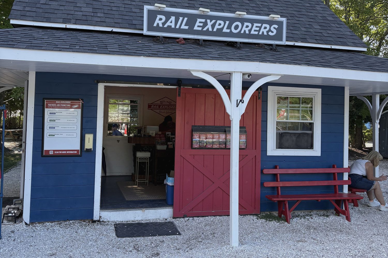 The Rail Explorers depot, a small blue and red clapboard building